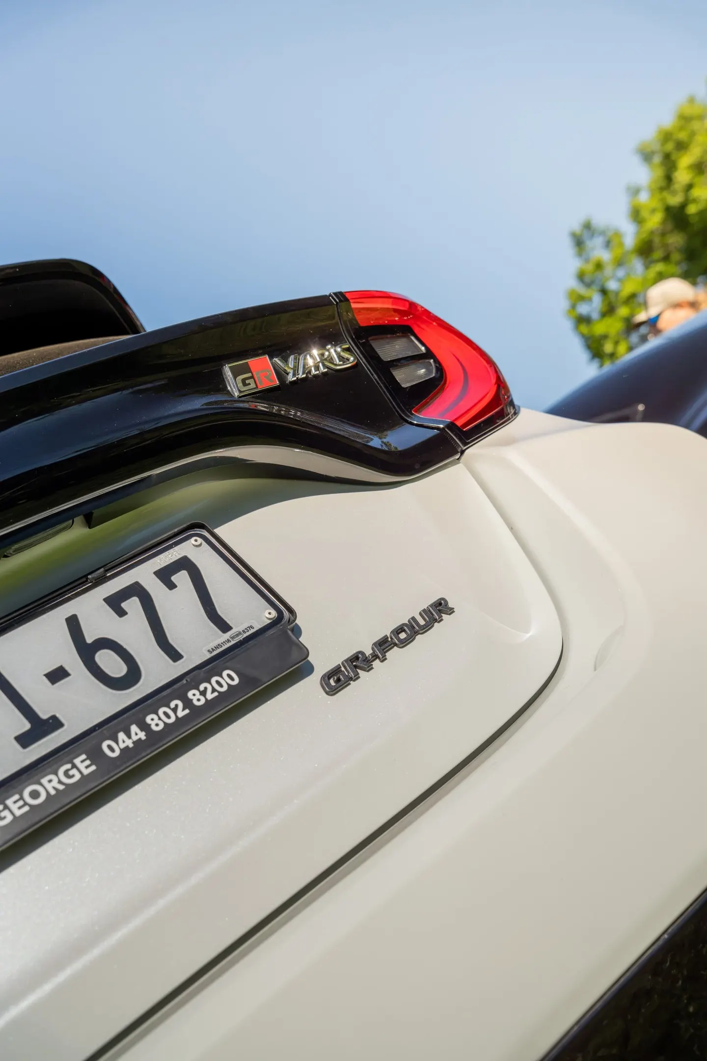 The GR-Four badge on a white Toyota GR